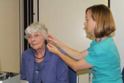 Audiologist with patient